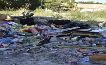 Lote baldío lleno de basura, sector Los Ángeles